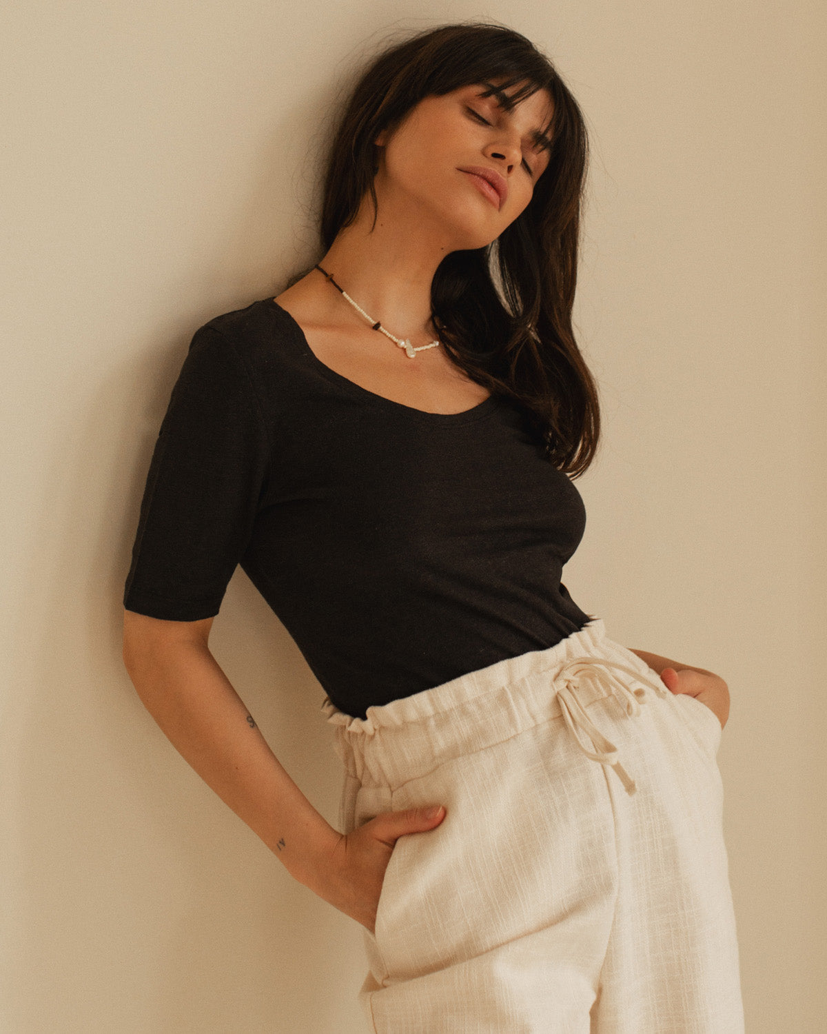 black t-shirt with wide neckline and longer sleeves