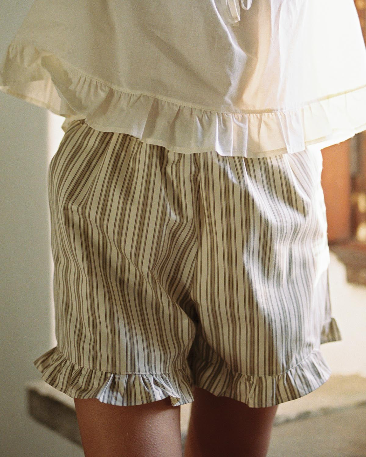 brown and beige striped shorts with elastic waistband