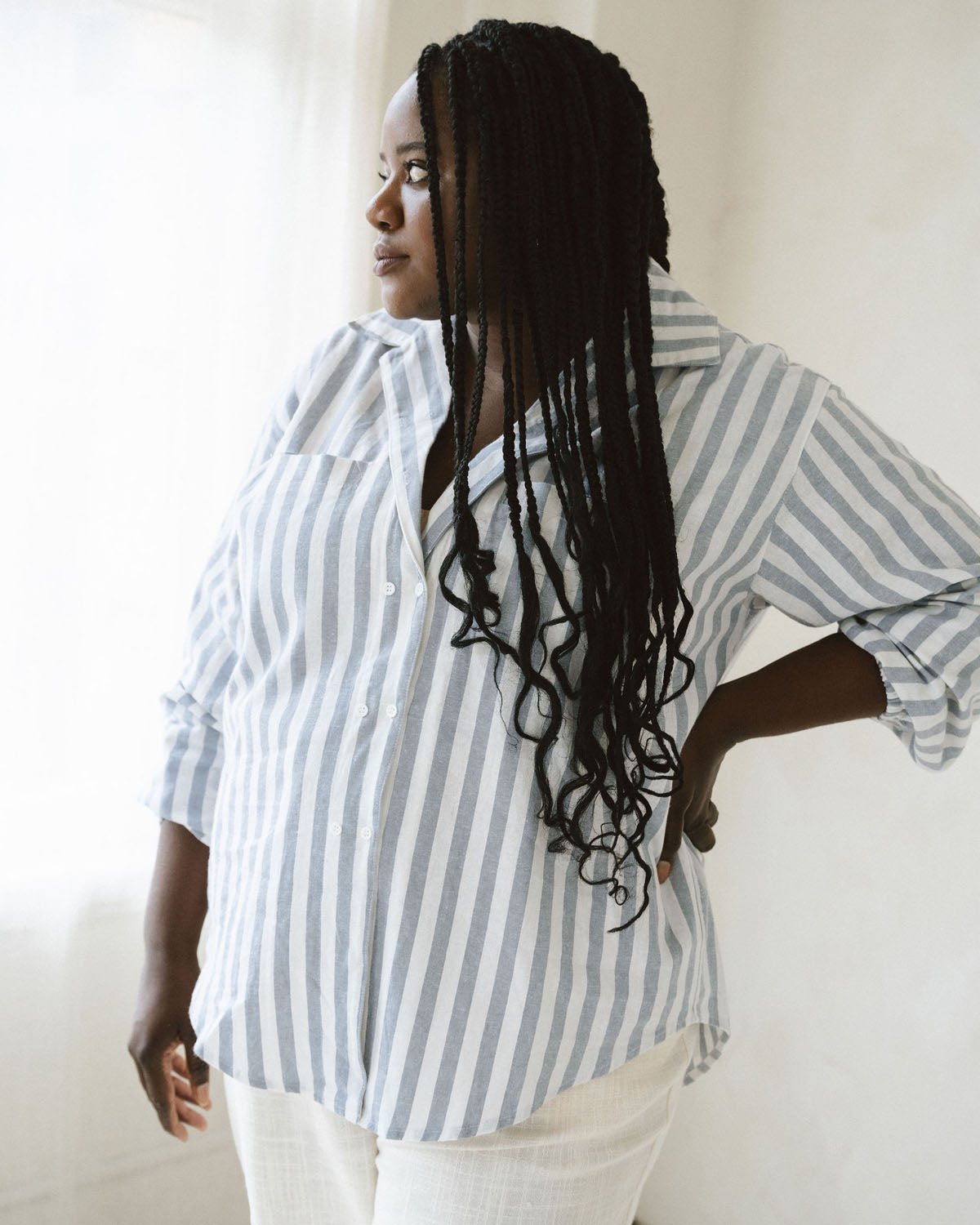 vertical stripe blue and white button up blouse made from a linen and cotton blend
