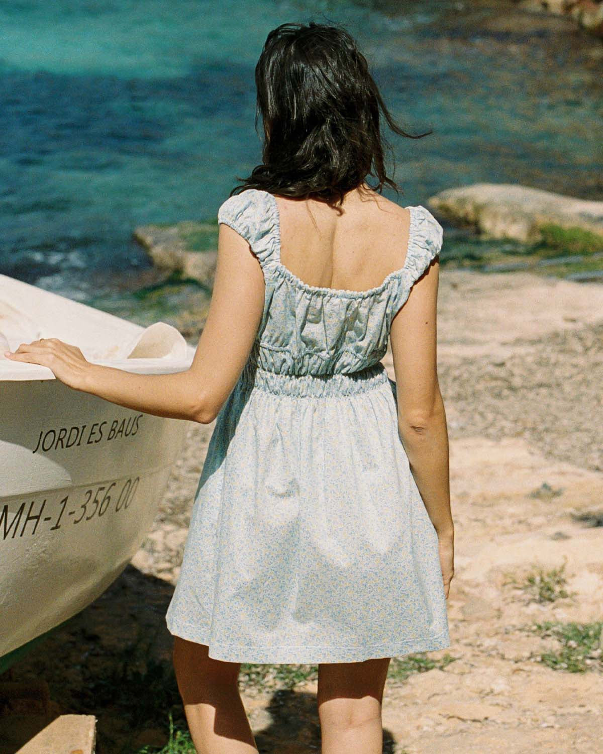 blue and yellow floral mini dress with cap sleeves and cinchable bust