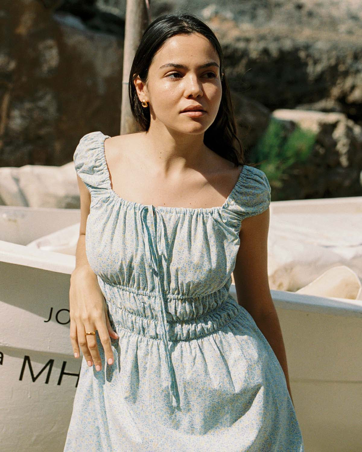 blue and yellow floral mini dress with cap sleeves and cinchable bust