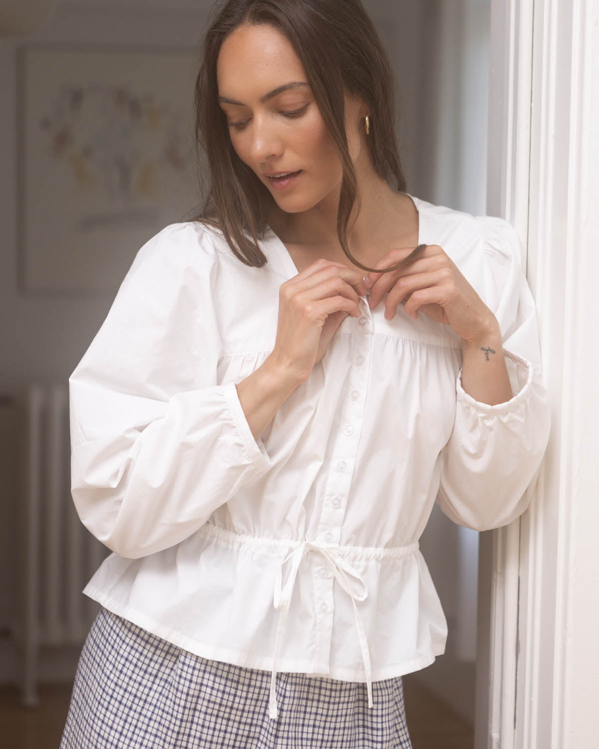 white cotton blouse with buttons and waist tie