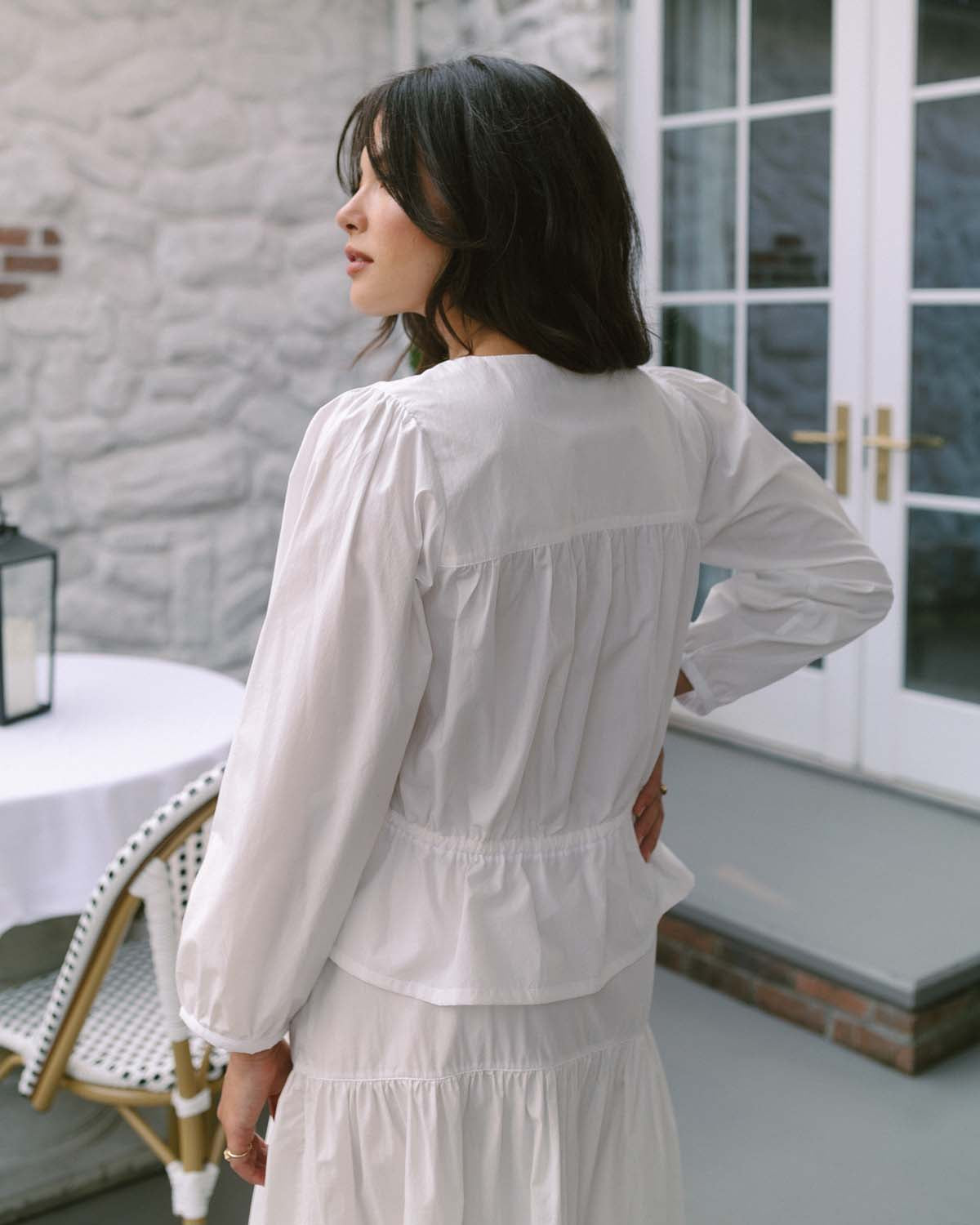 white cotton blouse with buttons and waist tie