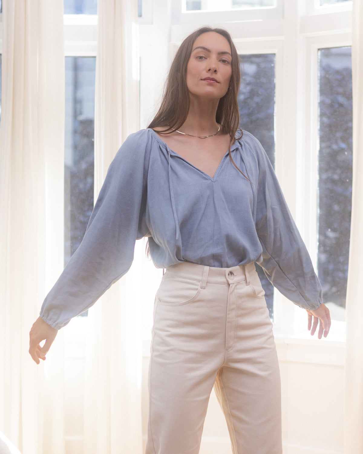 light blue blouse with elastic sleeves and tie