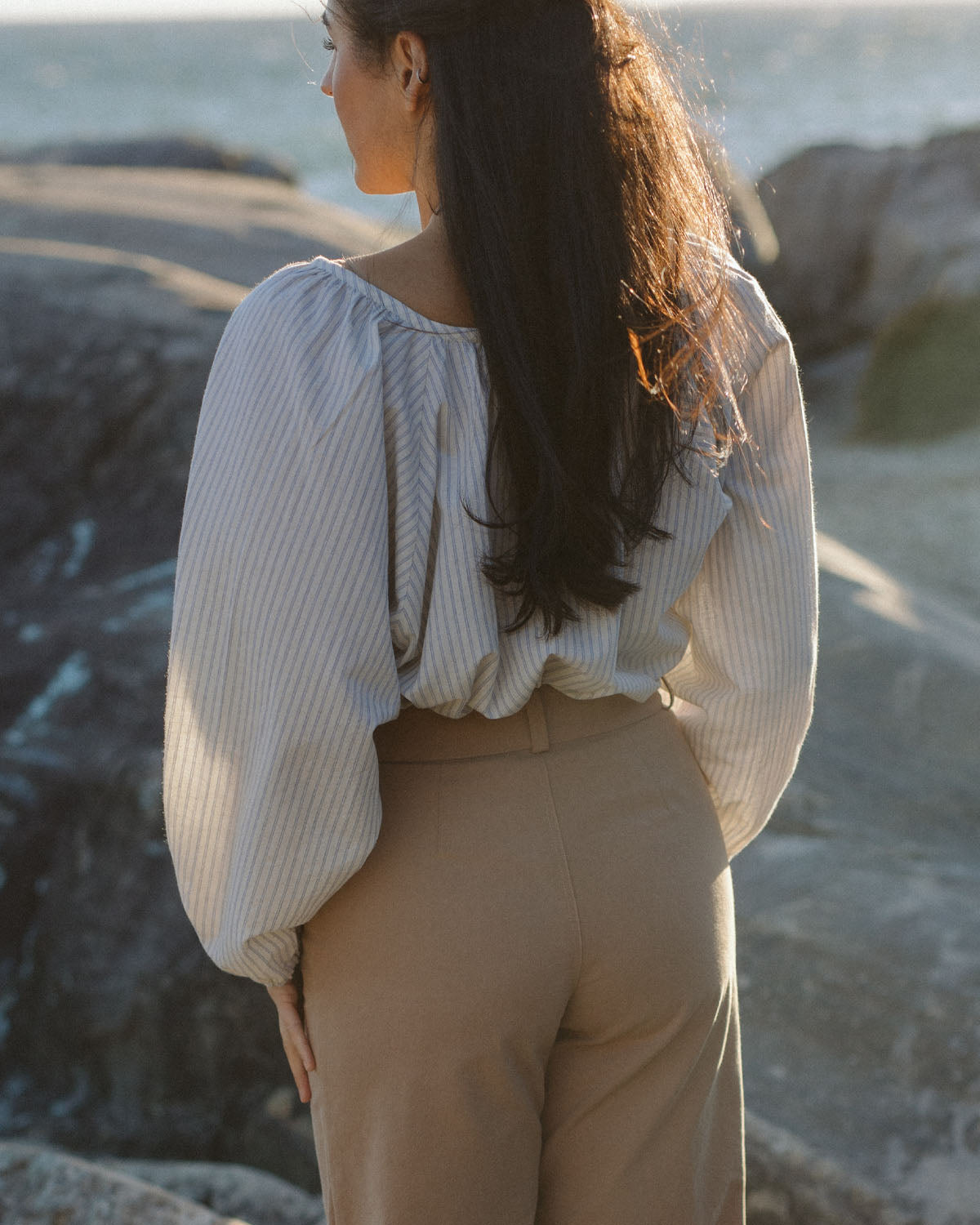 white and blue striped blouse with elastic sleeve cuffs and tie