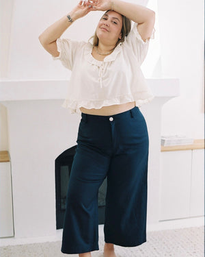 high-waisted navy pants with front pockets and belt loops
