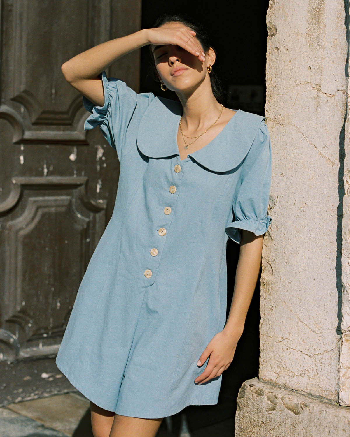 baby blue organic cotton romper with peter pan collar and puff sleeve