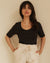 black t-shirt with wide neckline and longer sleeves