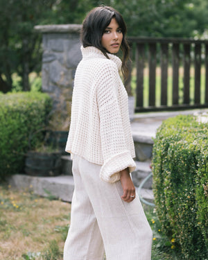 cream mockneck sweater made from cotton, wide sleeves