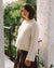 cream sweater with wide sleeves and ribbed neckline