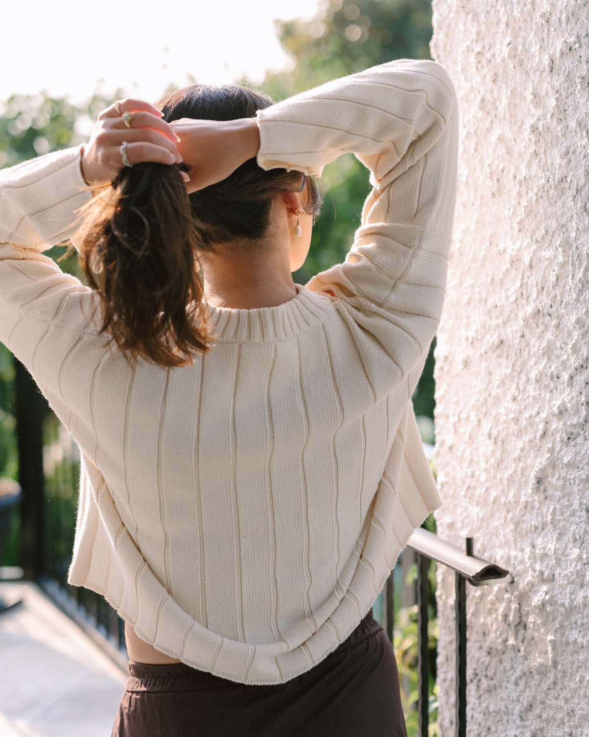 cream sweater with wide sleeves and ribbed neckline