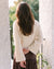 cream sweater with wide sleeves and ribbed neckline