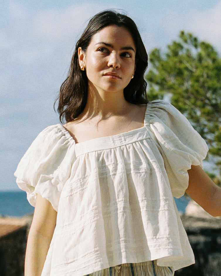 white cotton blouse with puff sleeves