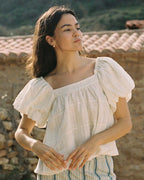 white cotton blouse with puff sleeves
