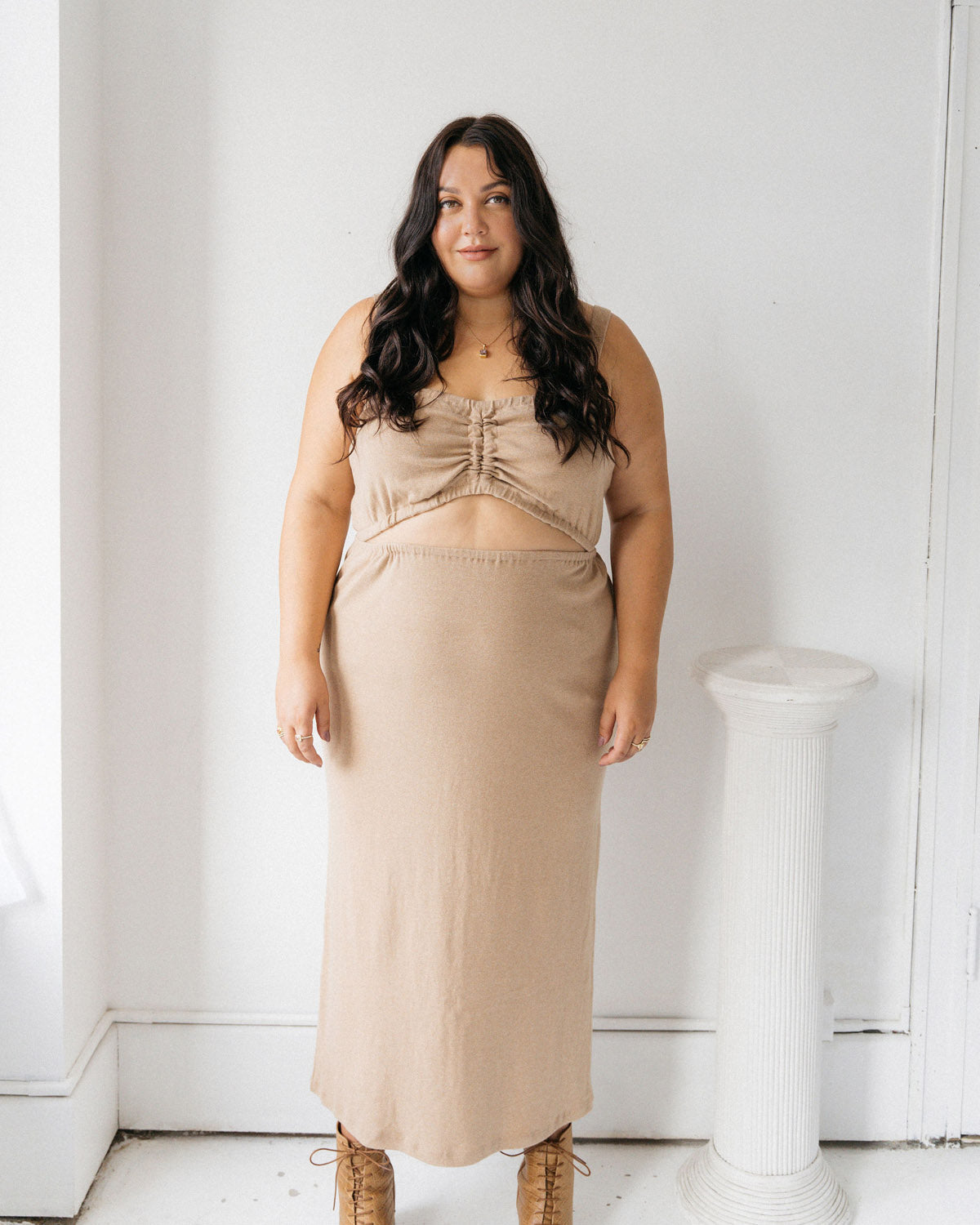 Tan, stretchy cropped tank top made of organic cotton