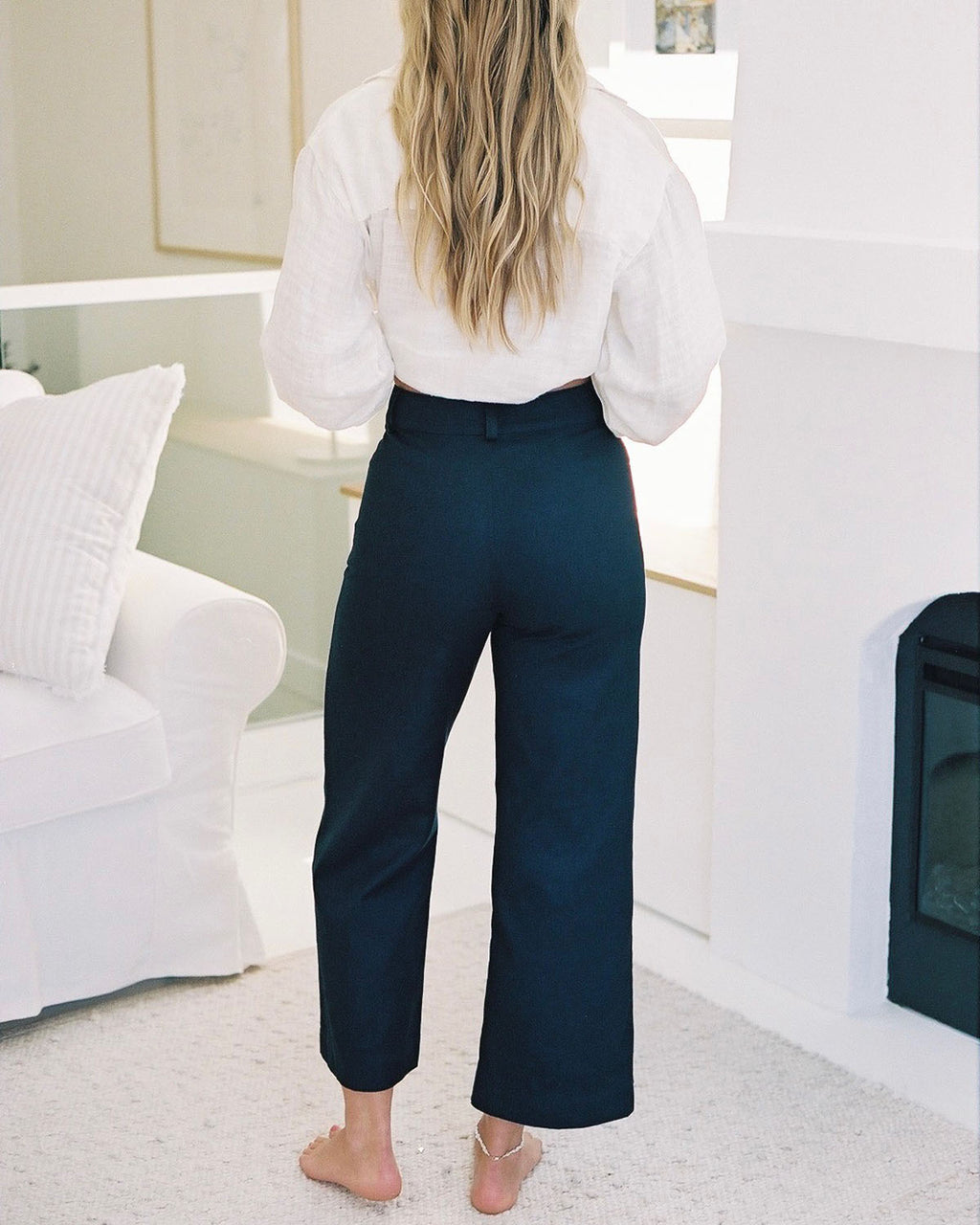 high-waisted navy pants with front pockets and belt loops