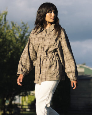 plaid fall jacket with front pockets, cinch waist, and elastic sleeves