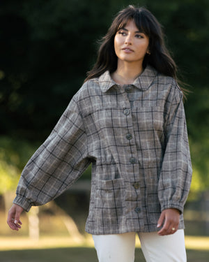 plaid fall jacket with front pockets, cinch waist, and elastic sleeves