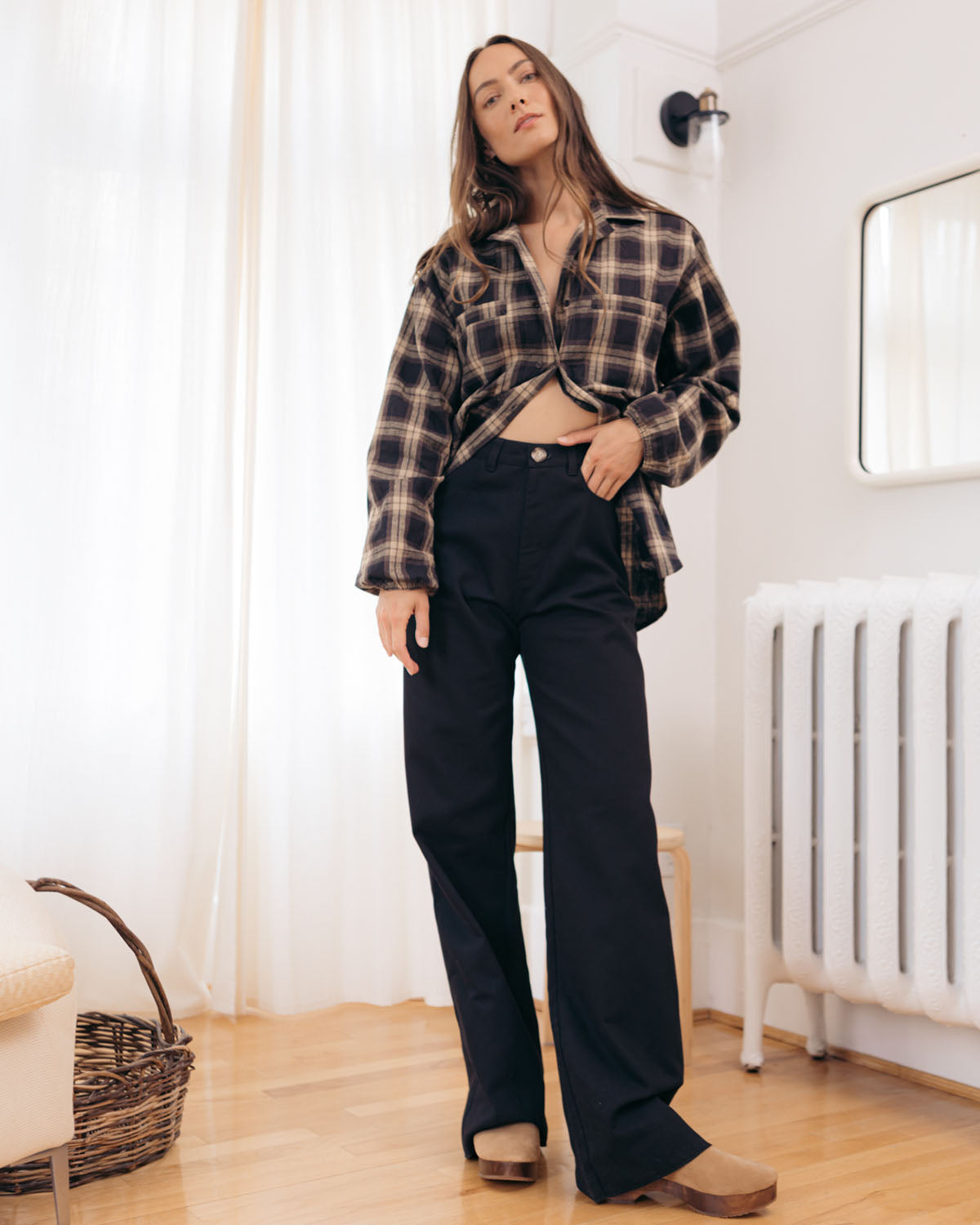 black high-waisted loose leg pants with raw hem