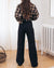 black high-waisted loose leg pants with raw hem