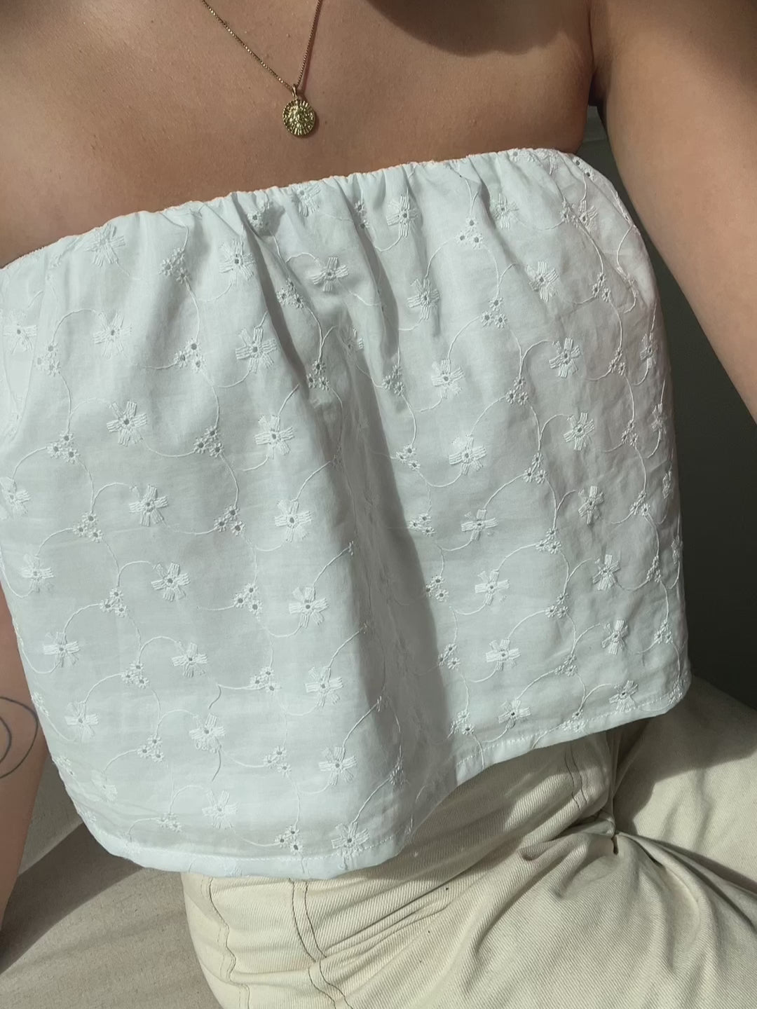 white eyelet tube top made from cotton