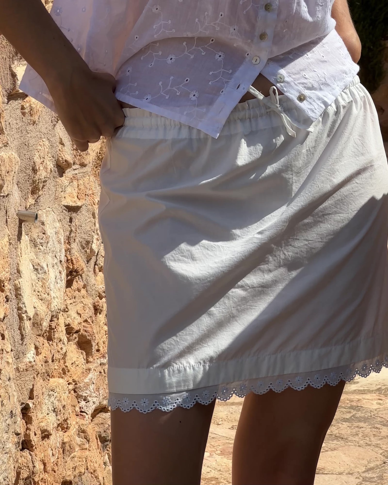 ivory mini skirt with tie front waistband and lace trim hem