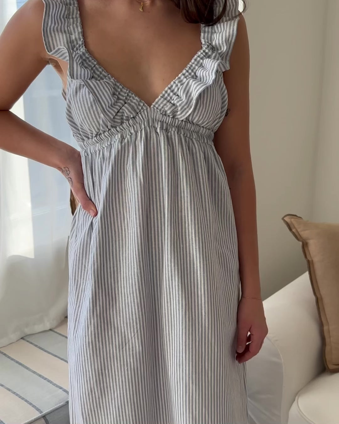 light blue and white striped dress made from a blend of linen and cotton