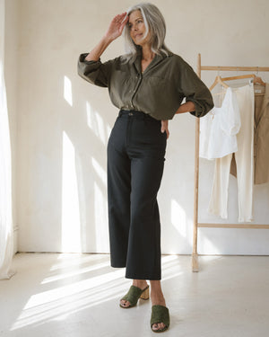 black wide-leg crop pants with belt loops and front pockets