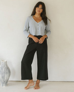3/4 sleeve blouse with button front, in grey. paired with black wide leg cropped pants