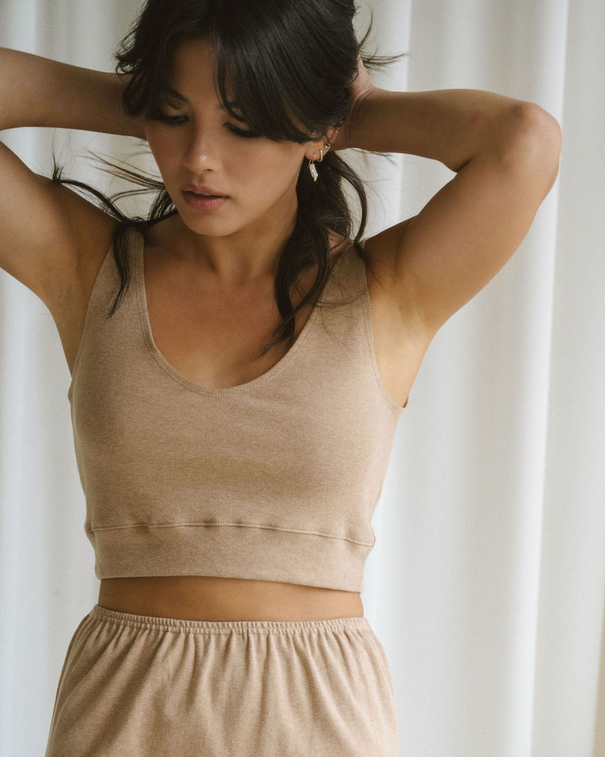brown form-fitting knit top made from organic cotton