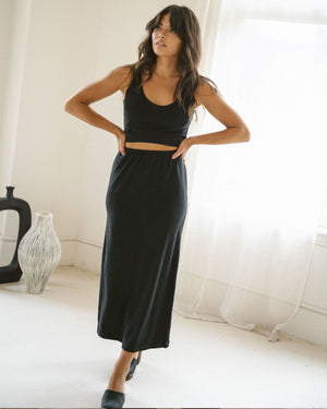 black knit stretchy skirt with elastic waistband and back slit
