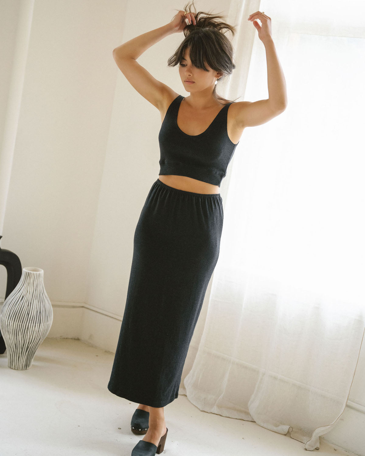 black knit stretchy skirt with elastic waistband and back slit
