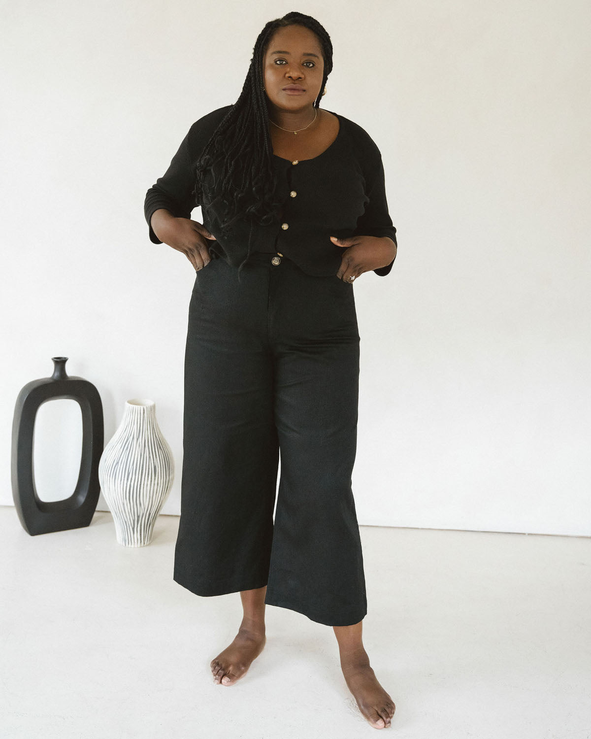 black wide-leg crop pants with belt loops and front pockets