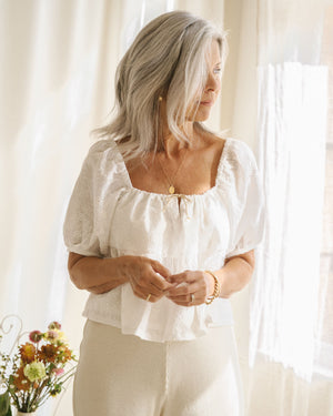 puff sleeve blouse in white embroidered fabric