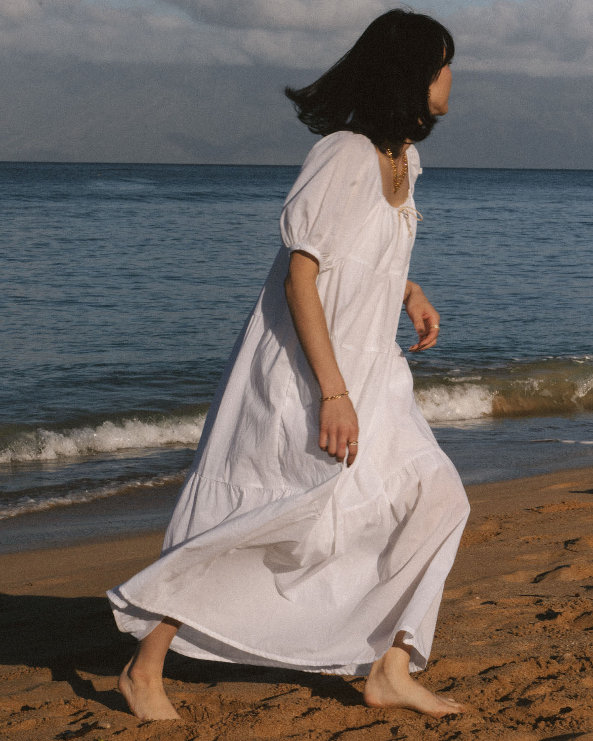 white puff sleeve, tiered dress made from organic cotton