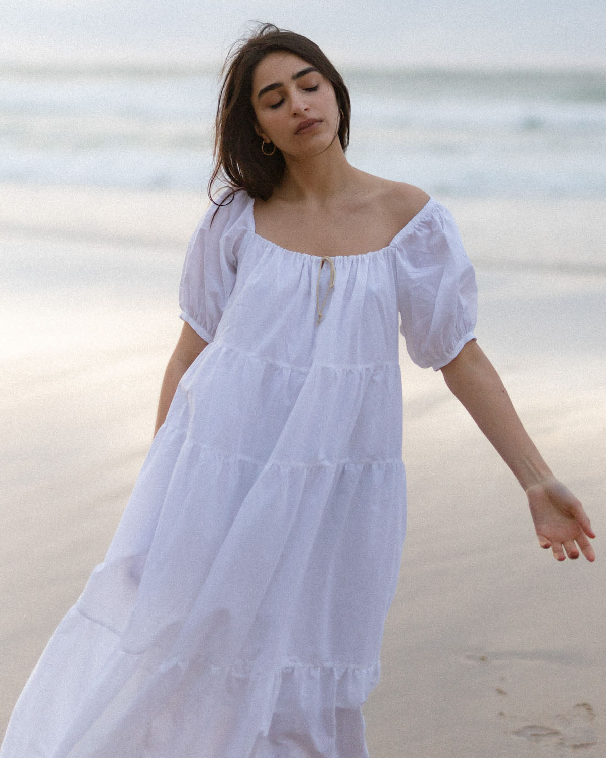 white puff sleeve, tiered dress made from organic cotton
